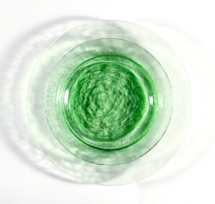 Kiwi Glass plate collection featuring a translucent green hue with a textured finish, available in 8.25-inch salad plate and 10.5-inch dinner plate sizes — ideal for adding a fresh, modern touch to any tablescape.