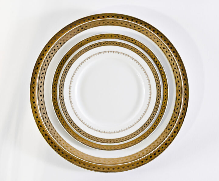 Imperial Gold Band China collection featuring elegant white porcelain accented with a luxurious gold rim and intricate border detailing. Includes Bread & Butter Plate (6.75"), Soup Rim (8.75"), Salad / Dessert Plate (7.75"), Luncheon Plate (9.5"), Dinner Plate (10.25"), Demitasse Saucer, Demitasse Cup (4 oz.), Coffee / Tea Saucer, and Coffee / Tea Cup. Perfect for upscale events, weddings, and formal dining.