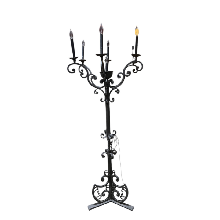 Tall wrought iron floor candelabra with ornate scroll detailing and multiple candle-style electric lights, 72 inches high, shown on a white background.