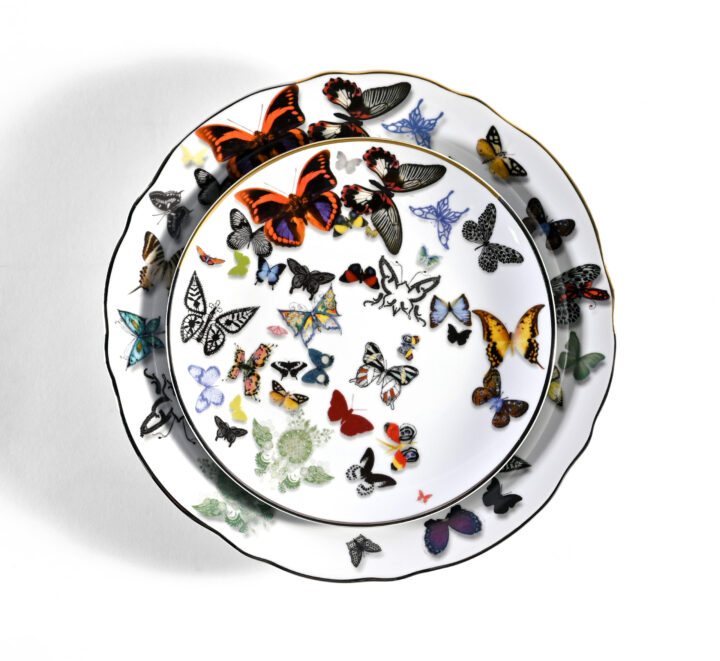 Butterfly Parade dinnerware featuring a vibrant multicolor butterfly motif on fine white porcelain. Includes Dinner Plate (10.25") and Salad / Dessert Plate (7.6"). Designed with delicate detailing and a scalloped edge, perfect for elegant or whimsical table settings.