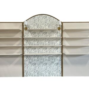 Patrizi Bar Back in ivory and gold measuring 14'L x 30"W x 8'H. Features elegant shelving with a soft ivory finish, gold trim, and a floral-patterned center panel with decorative sconces.