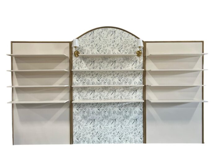 Patrizi Bar Back in ivory and gold measuring 14'L x 30"W x 8'H. Features elegant shelving with a soft ivory finish, gold trim, and a floral-patterned center panel with decorative sconces.