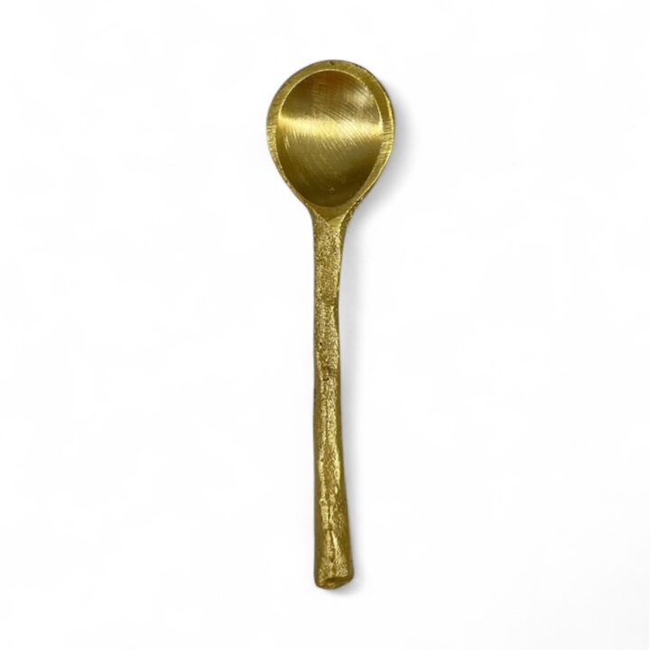 Gold salt and pepper cellar spoon featuring a small oval bowl and a hand-forged textured handle with a matte metallic finish, displayed against a white background.