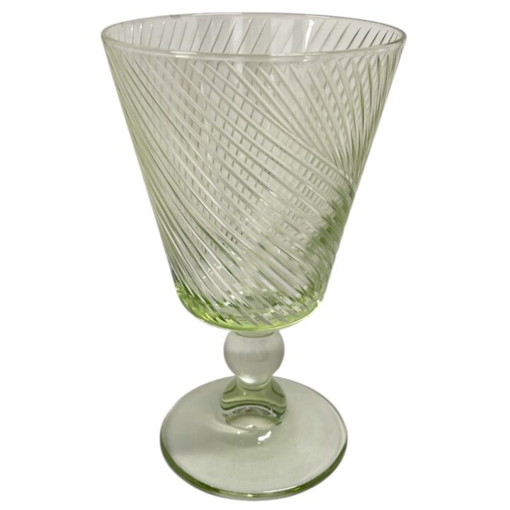 Green glass goblet with diagonal swirl pattern, and rounded stem. The glass features a soft green tint and holds approximately 10 ounces.