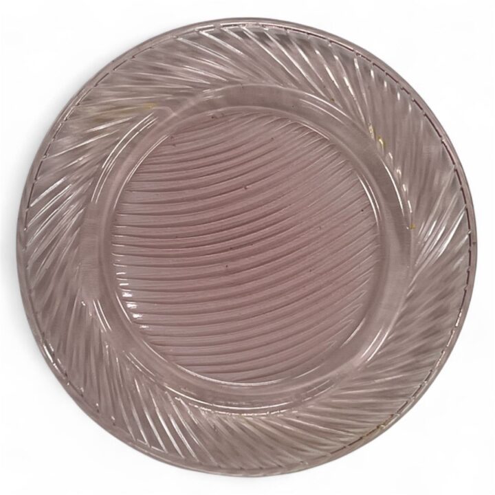 Pink glass bread or hors d'oeuvre plate with a subtle swirl pattern and textured rim. The plate has a translucent finish and measures approximately 6 inches in diameter.
