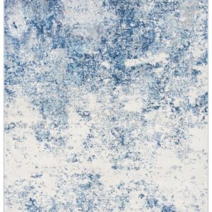 Ivory and navy area rug measuring 8' x 10', featuring a contemporary abstract pattern with blended blue and white tones. This modern rug adds texture and visual interest to lounges, event spaces, or home interiors.