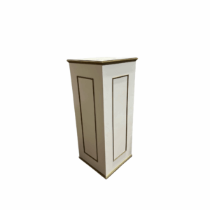 Patrizi Pedestal in ivory and gold featuring clean rectangular paneling with metallic gold trim.