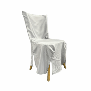 Cross Back Chair Cover in soft white fabric designed to drape elegantly over wooden chairs. Features tailored seams and front slits for a clean, refined look—perfect for weddings, banquets, and upscale event settings.