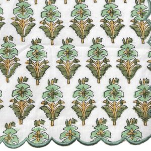 Scalloped dinner napkin in white and green with a botanical floral block print and stitched scalloped border.