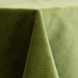 Green velvet 132-inch round table linen with a soft, matte sheen and rich, saturated leaf-colored fabric.