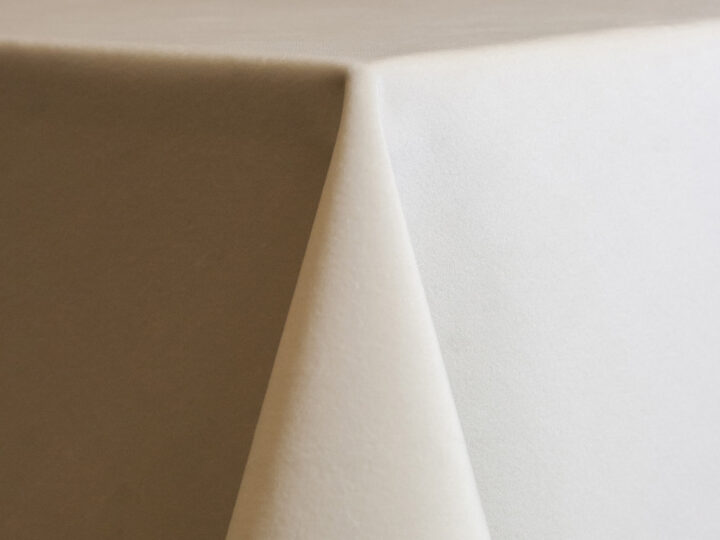 Cream velvet 132-inch round table linen with a soft, neutral ivory tone and smooth, velvety finish.