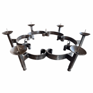 Iron Candelabra in Antique Iron — 30" diameter x 7.25" height round metal candle holder with rustic iron finish and spiked holders, ideal for taper candles and statement centerpieces.