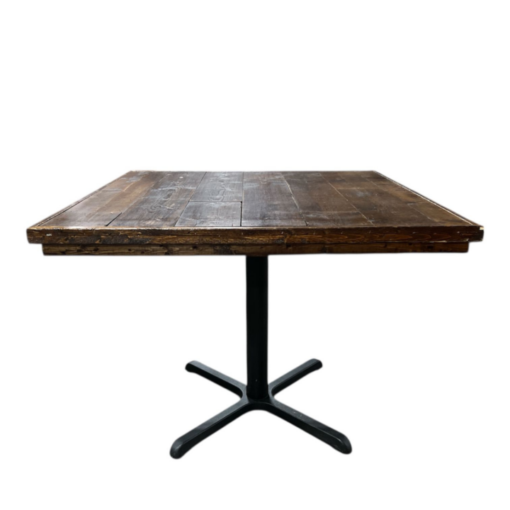 Reclaimed wood square bistro table with rustic plank tabletop and black metal pedestal base, 36-inch event table suitable for indoor or outdoor use.