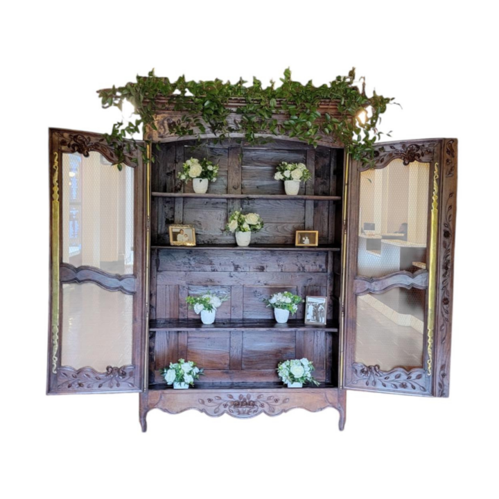 Antique wooden armoire hutch with carved detailing and open display shelves — vintage display cabinet for weddings and events
